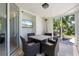 Relaxing screened patio with outdoor dining and a TV, ideal for al fresco meals at 7118 Hawks Harbor Cir, Bradenton, FL 34207