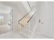 Bright entryway features marble floors and a modern staircase with metal cable railings at 7118 Hawks Harbor Cir, Bradenton, FL 34207