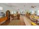 Spacious common room with comfortable seating, ceiling fans, and plenty of natural light at 7155 Boca Grove Pl # 102, Lakewood Ranch, FL 34202