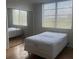Cozy bedroom featuring a large window and a spacious closet at 7461 W Country Club N Dr # 201, Sarasota, FL 34243
