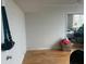 A spacious bedroom featuring hardwood floors and ample closet space for storage at 7461 W Country Club N Dr # 201, Sarasota, FL 34243