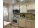 Updated kitchen with stainless steel appliances and plenty of storage at 7461 W Country Club N Dr # 201, Sarasota, FL 34243