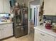 Well-equipped kitchen with stainless steel appliances and white cabinetry, showcasing style and functionality at 7461 W Country Club N Dr # 201, Sarasota, FL 34243