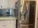 Well-lit kitchen features a stainless steel refrigerator with water dispenser at 7461 W Country Club N Dr # 201, Sarasota, FL 34243