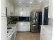 Bright kitchen with stainless steel appliances and ample cabinet space at 7461 W Country Club N Dr # 201, Sarasota, FL 34243
