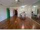 Open-concept living area featuring wood floors and an attached dining room at 7461 W Country Club N Dr # 201, Sarasota, FL 34243