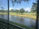 Enjoy peaceful water views from the comfort of this screened-in lanai at 7461 W Country Club N Dr # 201, Sarasota, FL 34243