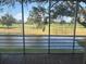 Relaxing screened patio with scenic views of the tranquil pond and golf course at 7461 W Country Club N Dr # 201, Sarasota, FL 34243
