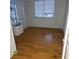 Bright and airy room with hardwood flooring and a large window providing ample natural light at 7461 W Country Club N Dr # 201, Sarasota, FL 34243