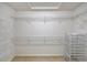 Walk-in closet offers a wire shelving system for ample storage solutions and organization at 7805 Allen Robertson Pl, Sarasota, FL 34240