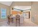 Bright kitchen boasts a breakfast bar, modern appliances, and ample cabinet space for storage at 7805 Allen Robertson Pl, Sarasota, FL 34240