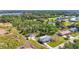 Aerial view of the home showing its proximity to the water and surrounding landscape and foliage at 80 Liles St, Terra Ceia, FL 34250