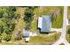 Aerial view of the home with a large backyard and separate shed for storage or hobbies at 80 Liles St, Terra Ceia, FL 34250