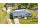 Aerial view of the house with a spacious yard and shed, perfect for outdoor activities and storage at 80 Liles St, Terra Ceia, FL 34250
