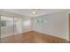 A bedroom featuring sliding doors and hardwood floors at 80 Liles St, Terra Ceia, FL 34250