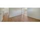 This bedroom features hard wood floors and sliding glass doors with access to another room at 80 Liles St, Terra Ceia, FL 34250