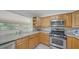 Bright kitchen featuring stainless steel appliances and light wood cabinets at 80 Liles St, Terra Ceia, FL 34250