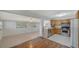 Open-concept kitchen with stainless steel appliances and a seamless transition to living area at 80 Liles St, Terra Ceia, FL 34250