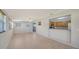 Open layout with tiled floors connecting to the kitchen area at 80 Liles St, Terra Ceia, FL 34250