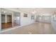 Open floor plan with access to multiple rooms and a sliding glass door at 80 Liles St, Terra Ceia, FL 34250