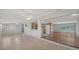 Open-concept living space with tiled floors and hardwood transition at 80 Liles St, Terra Ceia, FL 34250
