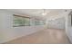 Spacious living room with tiled floors and plenty of natural light at 80 Liles St, Terra Ceia, FL 34250