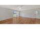 Living room featuring hardwood floors, natural light, and a sliding door at 80 Liles St, Terra Ceia, FL 34250