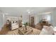 Bright and airy living room with hardwood floors, cozy seating, and adjoining dining area at 80 Liles St, Terra Ceia, FL 34250