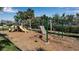 Community playground featuring a swing set, slides, and various play structures at 80 Liles St, Terra Ceia, FL 34250