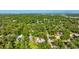 Aerial view of home showing lush tree canopy and proximity to neighborhood amenities at 801 Oak Vista Dr, Sarasota, FL 34232