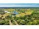 Gorgeous aerial view of the property surrounded by lush landscaping and serene water features at 801 Oak Vista Dr, Sarasota, FL 34232