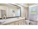 Bathroom features a vanity, tub and shower combo, and bright lighting at 801 Oak Vista Dr, Sarasota, FL 34232
