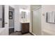 Bathroom with vanity, mirror, and glass shower stall at 801 Oak Vista Dr, Sarasota, FL 34232