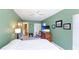 Relaxing bedroom with green walls, ceiling fan, and decor at 801 Oak Vista Dr, Sarasota, FL 34232