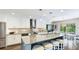Spacious modern kitchen featuring a large center island, stainless steel appliances, and sleek countertops at 801 Oak Vista Dr, Sarasota, FL 34232