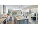 Bright kitchen with a center island, stainless steel appliances, and an adjacent dining area at 801 Oak Vista Dr, Sarasota, FL 34232