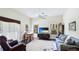 Comfortable living room area with vaulted ceilings, a cozy seating area and natural light at 801 Oak Vista Dr, Sarasota, FL 34232