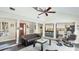 Bright open-concept living room with vaulted ceilings flowing into a modern kitchen at 801 Oak Vista Dr, Sarasota, FL 34232