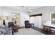 Well-lit living room with wood-look floors and a comfortable seating arrangement at 801 Oak Vista Dr, Sarasota, FL 34232