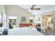 Spacious main bedroom with natural light, a view to an ensuite bathroom and closet at 801 Oak Vista Dr, Sarasota, FL 34232