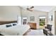 Bright main bedroom with a vaulted ceiling, and large windows with a serene view at 801 Oak Vista Dr, Sarasota, FL 34232