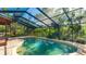 Sparkling pool with a screened enclosure and brick patio at 801 Oak Vista Dr, Sarasota, FL 34232