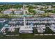 Aerial view of a marina filled with yachts and boats in a coastal community with lush green trees at 815 31St W Ave, Palmetto, FL 34221