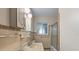 Bathroom featuring tiled walls, a bathtub, and a vintage sink at 815 31St W Ave, Palmetto, FL 34221