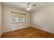 Bedroom with wood floors and a window with lots of natural light at 815 31St W Ave, Palmetto, FL 34221