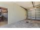 Spacious garage with roll-up door and work area ready for customizations and storage at 815 31St W Ave, Palmetto, FL 34221
