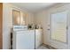 Laundry area featuring a window, washer, and dryer at 815 31St W Ave, Palmetto, FL 34221
