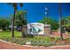Sutton Park sign with brick base, landscaped surroundings, and a clear blue sky at 815 31St W Ave, Palmetto, FL 34221