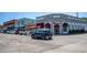 Street view of the downtown area showcasing commercial buildings, parked cars, and pedestrian crosswalk at 815 31St W Ave, Palmetto, FL 34221