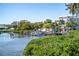 Scenic waterfront view highlighting docks, boat, and lush greenery at 815 31St W Ave, Palmetto, FL 34221